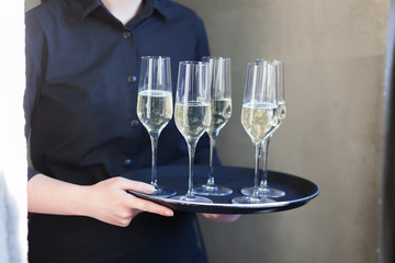 waitress at restaurant serving wine