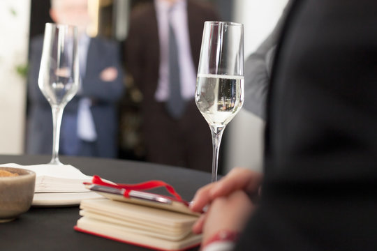 drinking white wine at a company celebration event