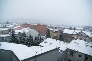 Fototapeta premium Snowfall in the town. Slovakia