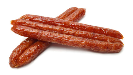 Smoked sausages on white background
