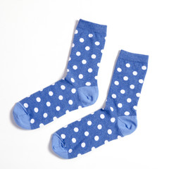 blue polka dotted socks on white background