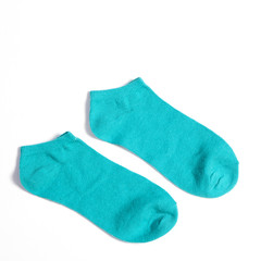 Green socks on white background