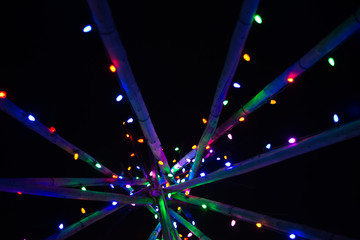 Abstract multicoloured Christmas lights on poles