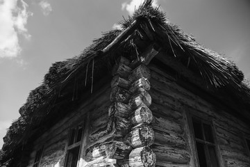 old shabby wooden house with a broken roof near