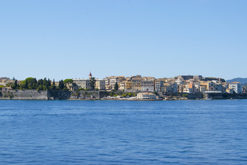 Panoramic view of Corfu island from water. Castle and old town