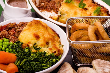Shepherd’s Pie Dinner
Shepherds Pie topped with Colcannon potato, with a selection of fresh vegetables and Irish Stout battered onion ring.