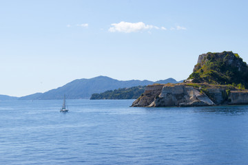 Fototapeta na wymiar Panoramic view of Corfu island from water. Castle and old town