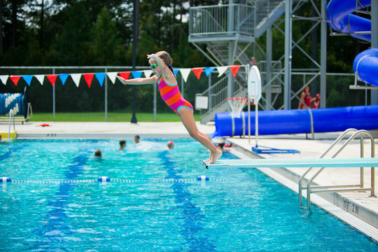 Little Girl Swim Lessons off Diving Board