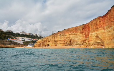 Fototapeta na wymiar Sea cave on the Algarve coast near Benagil, Portugal, Europe. Nature geology seen from boat trip. 