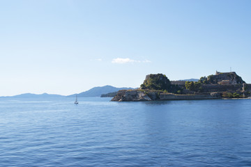 Panoramic view of Corfu island from water. Castle and old town