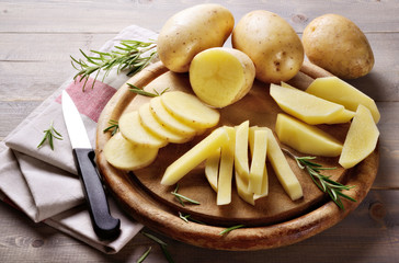 Raw potatoes and rosemary