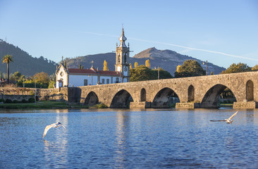 Roman bridge in Ponte de Lima town, Portugal - view with Santo Antonio da Torre Velha church