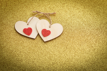Fototapeta premium Happy Valentines Day / occasional decorative hearts on a shiny gold background with a place for an inscription