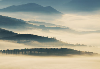 silhouettes of mountains. autumn morning in the Carpathian mountains. foggy dawn