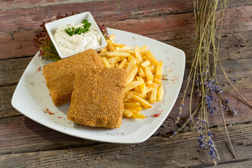 breaded cheese. On a wooden background. Top view. rustic food