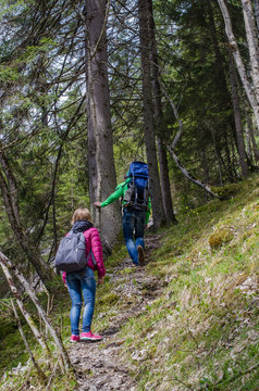 Family hike along the mountain path