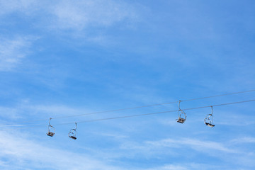 ski chair lift against blue sky
