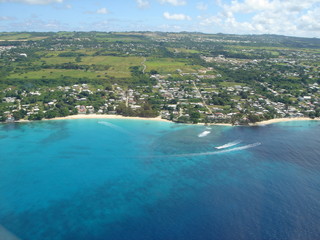Helicopter tour of the beautiful island of Barbados with turquoise water along the coastline
