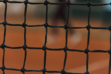 Tennis red court with gray net