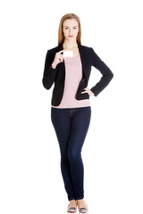Fototapeta premium Beautiful caucasin business woman holding personal card.