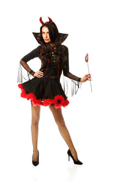 Woman wearing devil clothes holding trident