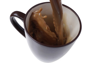 Pouring home made coffee into a cup. Café Latte