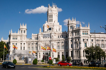 Plaza de Cibeles and City Hall in central Madrid with refugees sign