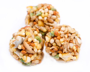 Garden veggie parrot food with carrots, peas and broccoli isolated on white background