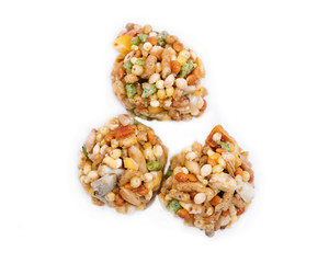 Garden veggie parrot food with carrots, peas and broccoli isolated on white background