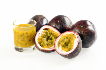 Purple passion fruit on white background.