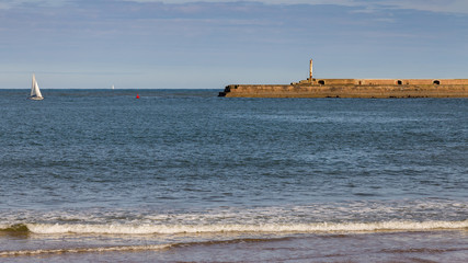 Lighthouse and pier at the North Sea coast of Roker Beach in Sunderland, Tyne and Wear, UK