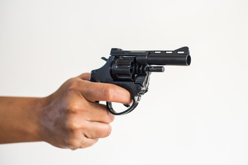 Hand shooting gun on white background.killer concept.