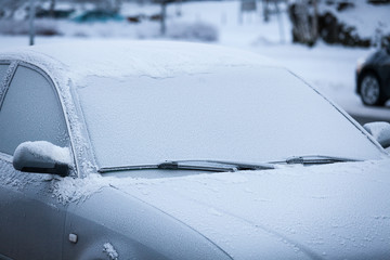 Car windshield covered in frost