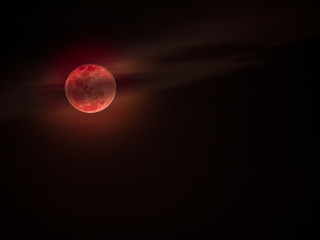 Bloodmoon or red moon with cloud on dark sky