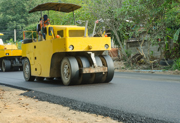 Road roller machine works asphalt road construction