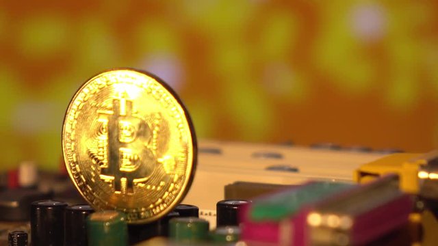 Cryptocurrency bitcoin gold. Bitcoins on the motherboard.A virtual business.