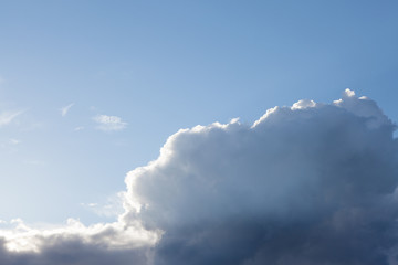 Big cloud on blue day sky