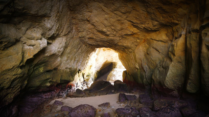 Beach Cave with Sunlight Shining In