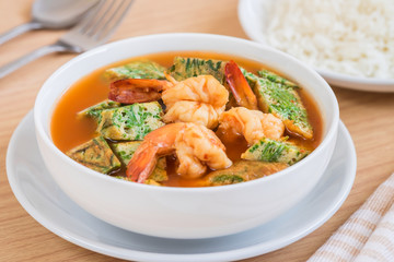 Acacia leave omelet and shrimp in spicy sour soup and rice on plate,  Thai food