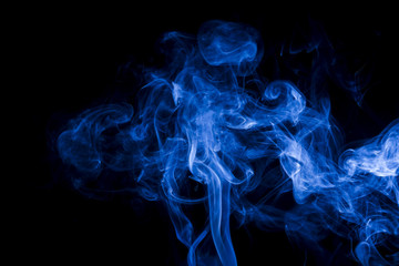 Fototapeta premium Blue smoke on black background