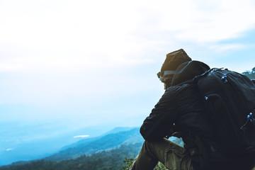 Men asians travel relax in the holiday. Admire the atmosphere landscape on the Moutain. Mountain Park happily. In Thailand