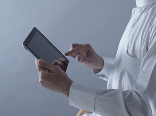 Saudi Arabian Man Hands Holding Tablet