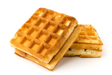 Waffles with condensed milk on a white.