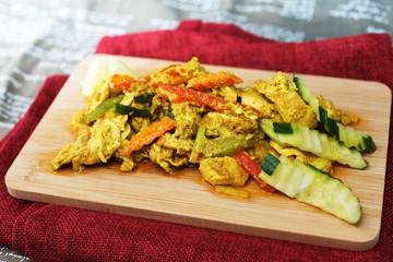 wok fried chicken stir fry with sweet peppers and chinese vegetables