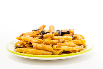Spaghetti with aubergine and tomato sauce on a the table