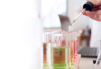 Researcher use science laboratory chemical test tube lab glassware equipment. Research and development concept.