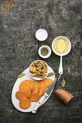 Ingredients for cooking healthy simple snacks from slices of sweet potato, walnuts with honey before baking. Top view. On a grunge gray background. Copy space