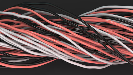 Twisted black, white and red cables and wires on black surface