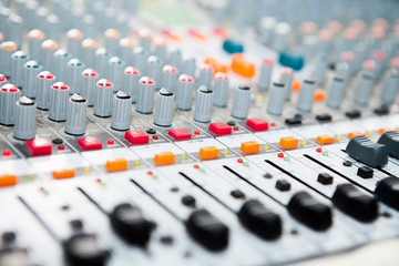 Obraz na płótnie Canvas Close-up of music mixer button, setting volume adjustment tools