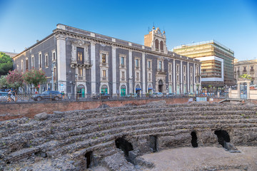 Catania, Sicily, Italy. Roman Amphitheater (II century AD) and Palazzo Tezzano Palace (1709)